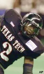 Ricky Williams and the Red Raiders fall to Iowa, 19-16, in the Alamo Bowl.