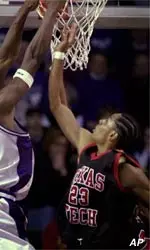 Kansas State forward Kelvin Howell goes up for a shot as Texas Tech guard Mikey Marshall defends during the first half of Sunday's game.