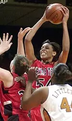 Texas Tech forward Plenette Pierson grabs a rebound with teammate center Jolee Ayers against the defense of Texas Center Carla Littleton, during first half.