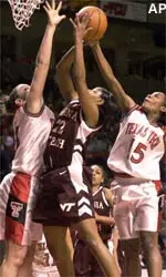 Texas Tech's Jia Perkins and teammate Jolee Ayers defend against a shot by Virginia Tech's Chrystal Starling in the first half of the NCAA Women's Basketball Mideast Regional.