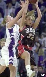 Texas Tech guard Amber Tarr intercepts a long pass intended for Kansas State forward Megan Mahoney during the second half of their game Sunday.