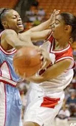 Texas Tech's Erin Grant, right, gets tangled up with Louisiana Tech's Tamaka Clay during their game of the State Farm Tip-off Classic.