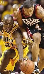 Minnesota's Stan Gaines and Texas Tech's Andre Emmett battle for a loose ball.
