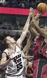 Andy Ellis contests the shot by Southern Illinois' Rolan Roberts in the first half of a first-round game at the NCAA East Regional.
