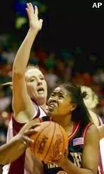 Tanisha Ellison looks to shoot against Oklahoma's Jamie Talbert during the first half of a women's NCAA West regional game.