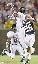 Joselio Hanson intercepts a pass by Southern Methodist quarterback Tate Wallis during Saturday's victory.