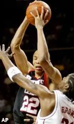 Kasib Powell goes up for a shot under pressure by Oklahoma guard Jabahri Brown in the first half.