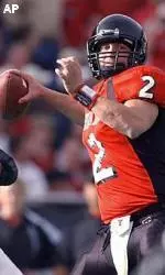 B.J. Symons throws for 15-yards during the second quarter, setting a new NCAA record of 5201 passing yards for a single season.