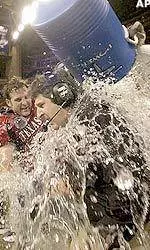 Mike Leach gets soaked during the final minutes of the Houston Bowl.