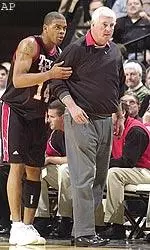 Junior Andre Emmett and Coach Knight survey action on the court.