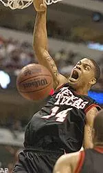Texas Tech Andre Emmett goes up for a dunk against Oklahoma, Saturday.