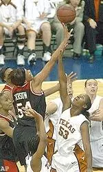 Texas Tech's Plenette Pierson shoots over Texas' Mercedes Williams, Saturday.