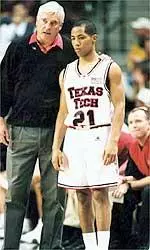 Coach Knight and Will Chavis courtside in the United Spirit Arena.