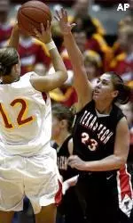 Natalie Ritchie tries to block the shot of Iowa State's Anne O'Neil during the first half.