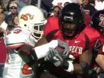 Oklahoma State's Jamie Thompson tries to wrestle the ball away from Taurean Henderson during the second quarter.