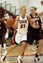 Cisti Greenwalt drives in the lane past Virginia Tech's Erin Gibson during the first half.