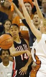 Erin Grant passes the ball past Texas defender Kala Bowers.
