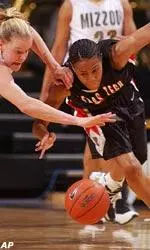 Missouri's Evan Unrau and Texas Tech's Latoya Davis battle for a loose ball.