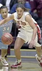 Guard Alesha Robertson chases down a loose ball during the first half.