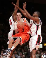 Martin Zeno and Darryl Dora guard Syracuse's Gerry McNamara on Thursday (AP Photo/Julie Jacobson)