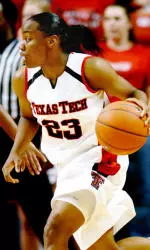 Tiny Henderson runs the basketball down the lane.