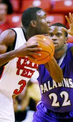 Martin Zeno is defended by Furman's Gerad Punch.