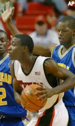 Martin Zeno drives to the basket against the Morehead State defense during the second half.