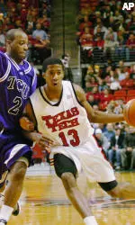 Terry Martin drives with the ball against Texas Christian's Brent Hackett (2) during the first half. (AP Photo/Lubbock Avalanche-Journal, Joe Don Buckner)
