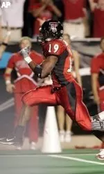 Taurean Henderson leaps into the end zone for one of four touchdowns against Texas A&M.