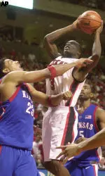 Martin Zeno attempts to score against Kansas' Wayne Simien.