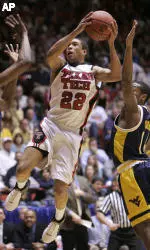 Jarrius Jackson goes up for a shot between West Virginia center D'or Fischer, left, and guard Darris Nichols.