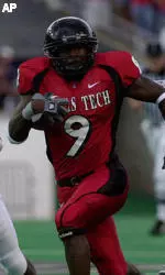 Receiver Robert Johnson runs from Sam Houston State's Byran Richmond on a pass play in the first half.