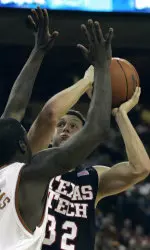 Texas Tech forward Jon Plefka shoots around the defense of Texas forward Mike Williams, left, during first half action in their college basketball game Tuesday, Jan. 17, 2006, in Austin, Texas. (AP Photo/Harry Cabluck)