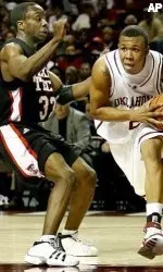 Lucquente White defends against Oklahoma's Michael Neal.