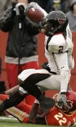 Texas Tech's Shannon Woods, top, runs over Iowa State's Jason Harris while scoring a second-half touchdown. (AP Photo/Charlie Neibergall)