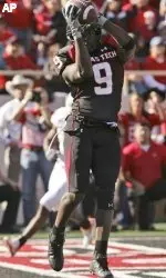 Texas Tech's wide receiver Robert Johnson (9) pulls in a 8-yard touchdown pass against Oklahoma State during the first half. (AP Photo/LM Otero)