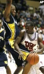 Texas Tech guard Martin Zeno, right, drives the lane as he is defended my Marquette guard Jerel McNeal in the first half. (AP Photo/Ed Zurga)