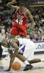 TCU forward Kevin Langford, bottom, goes for a loose basketball in front of Texas Tech guard Charlie Burgess (42) in the second half. (AP Photo/Donna McWilliam)