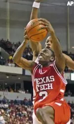 Texas Tech's Martin Zeno, front, goes up around Arkansas' Sonny Weems to score during the first half. (AP Photo/David Quinn)