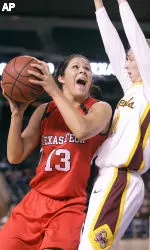 Jordan Murphree has her path to the basket blocked by Arizona State center Kirsten Thompson.