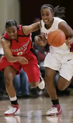 Stanford guard Candice Wiggins drives next to LaVonda Henderson in the first half.