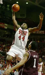 Darryl Dora drives the lane for two points around Texas A&M's Acie Law in the first half.