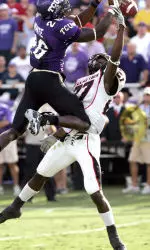 Edward Britton and TCU safety Marvin White reach for the pass in the second quarter.