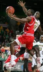 Martin Zeno goes to the basket in front of Baylor's Mamadou Diene.