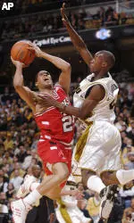 Jarrius Jackson shoots over Missouri's Keon Lawrence in the first half. (AP Photo/L.G. Patterson)