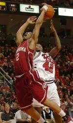 Oklahoma's Michael Neal and Charlie Burgess battle for a rebound.