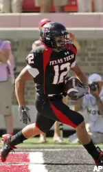 Eric Morris scores a touchdown against Texas A&M's Daanny Gorrer. (AP Photo/LM Otero)