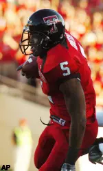 Texas Tech receiver Mike Crabtree (5) grabs a pass and heads for a touchdown while being chased by Iowa State's Chris Brown (8). (AP Photo/Lubbock Avalanche-Journal, Joe Don Buckner)