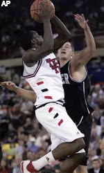 Martin Zeno, left, shoots the basket against Butler's Julian Betko. (AP Photo/Al Grillo)