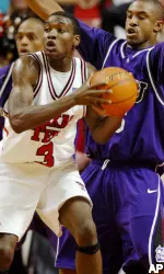 Martin Zeno (3) looks to pass the ball after being blocked by TCU's Neiman Owens (5) in the first half. (AP Photo/Lubbock Avalanche-Journal, Joe Don Buckner)